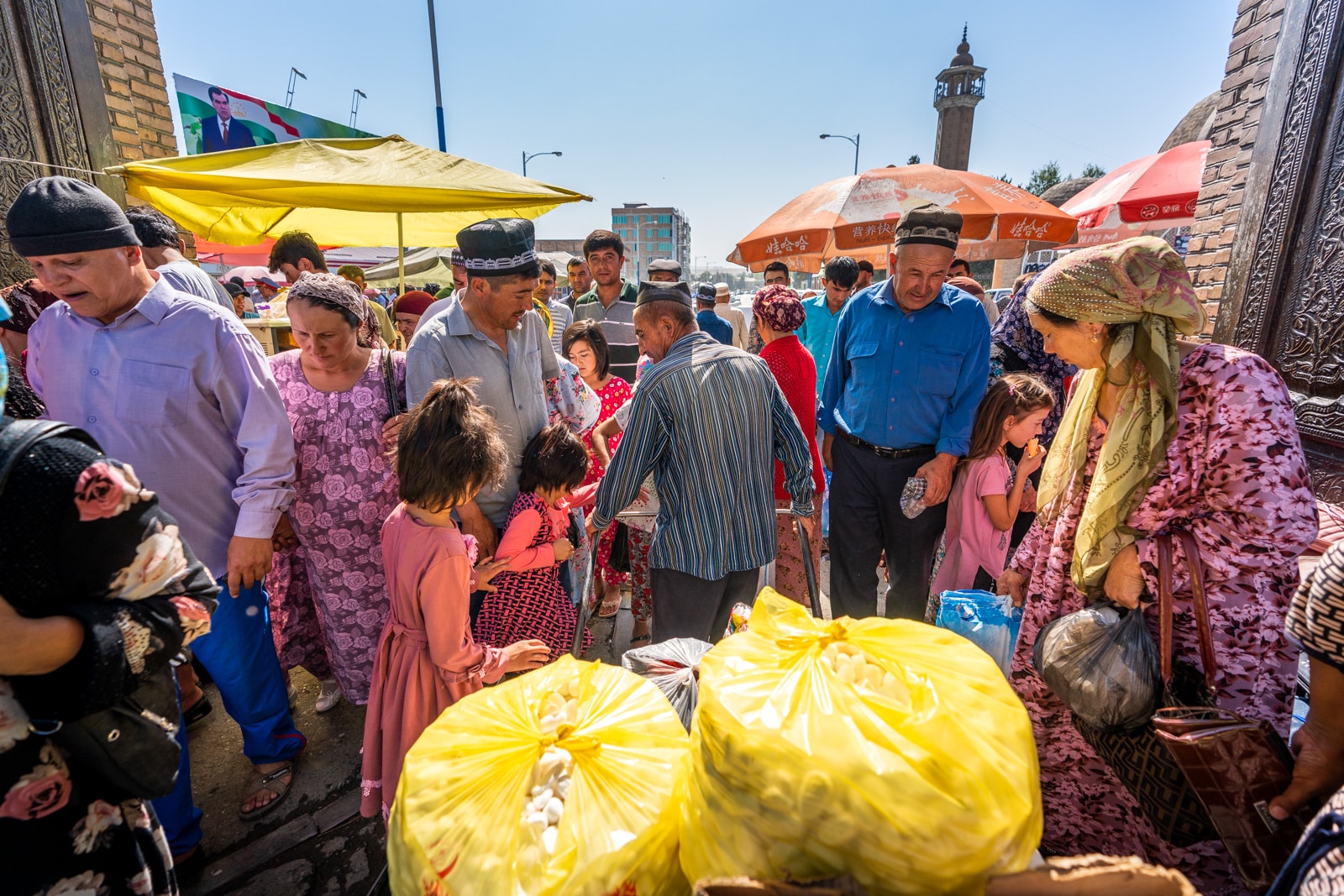 Man walking a cart through the Panjakent Bazaar in Western Tajikistan