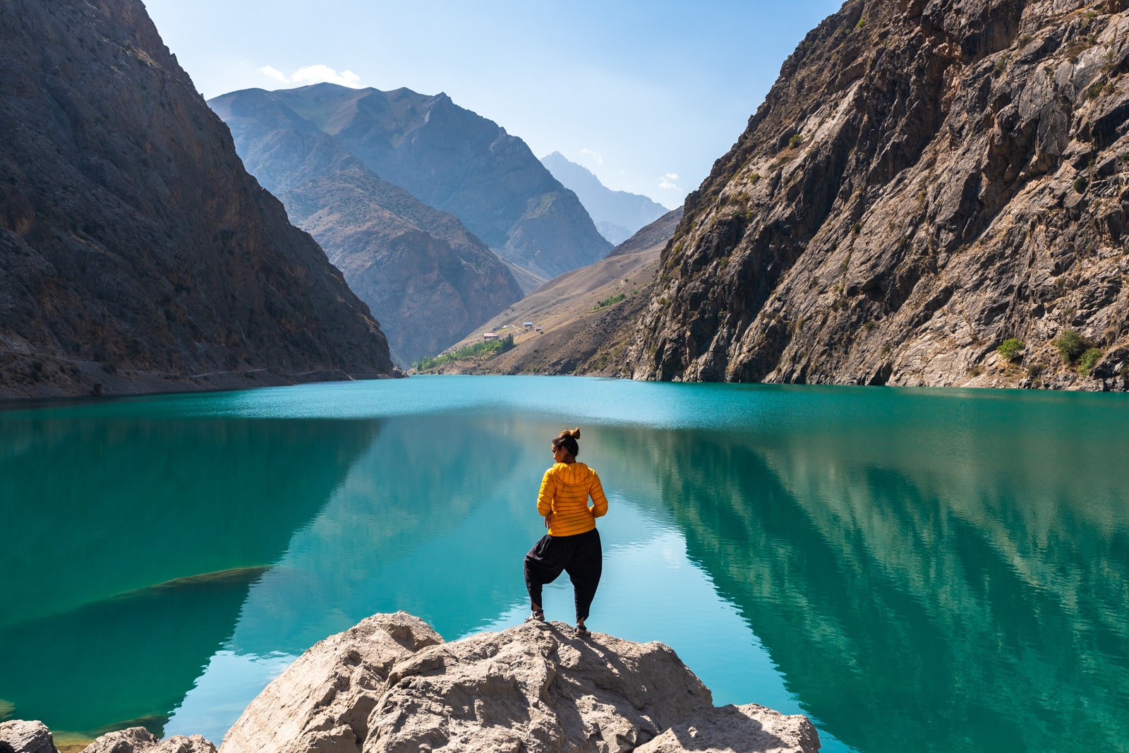 Girl standing in front of the fourth lake in Tajikistan's Haft Kol, Seven Lakes