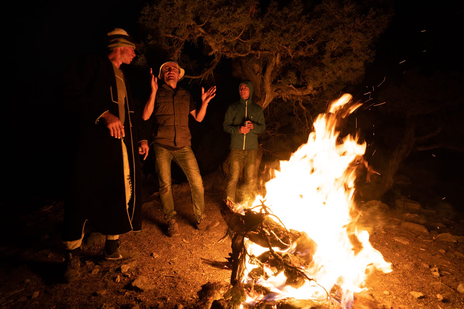 Men singing around a campfire in Western Tajikistan