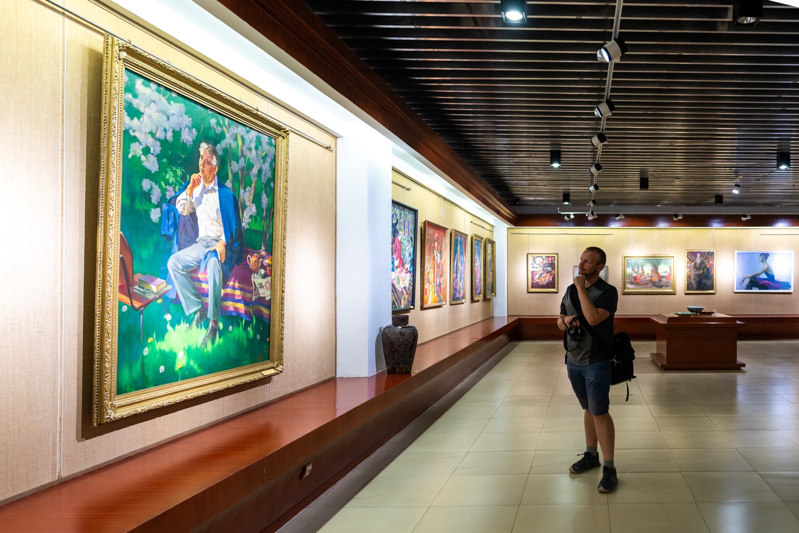 Man looking at art in the National Museum of Tajikistan in Dushanbe