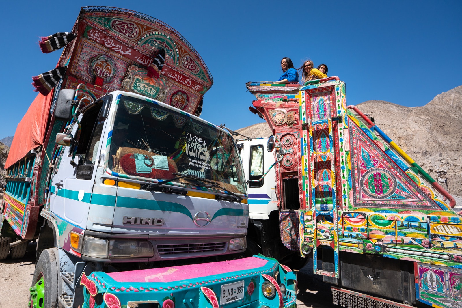 Girls sitting on top of a Pakistani truck in Gilgit Baltistan