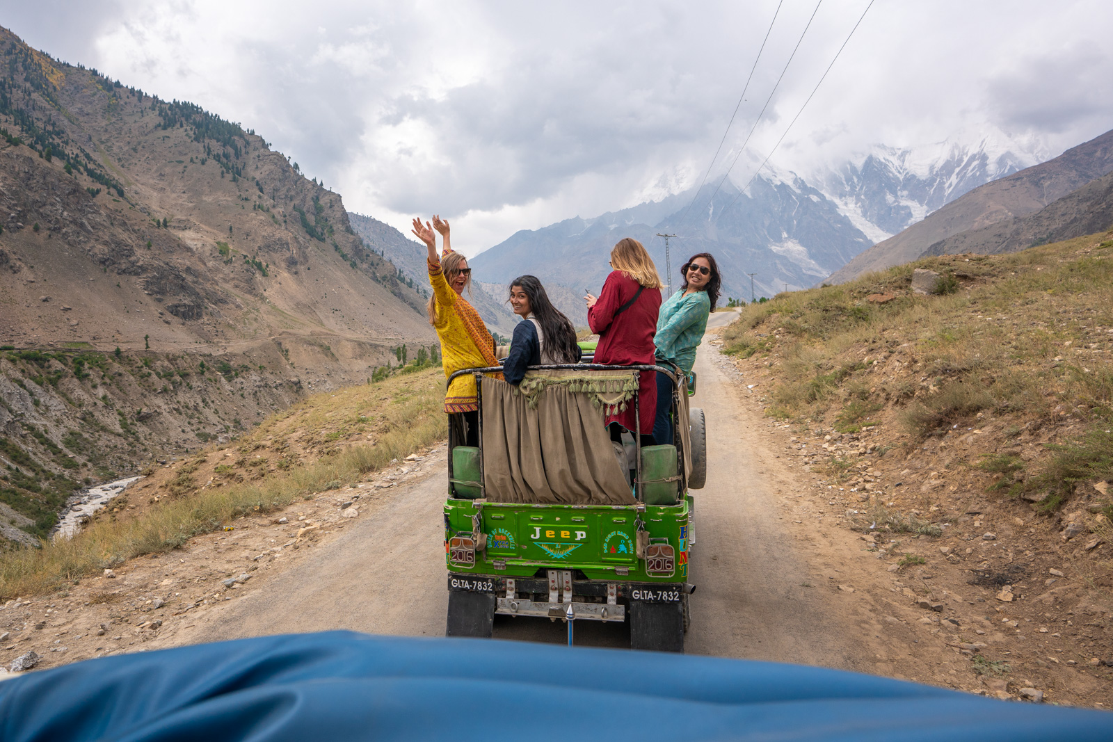 Female travelers in a jeep on a Pakistan women's tour