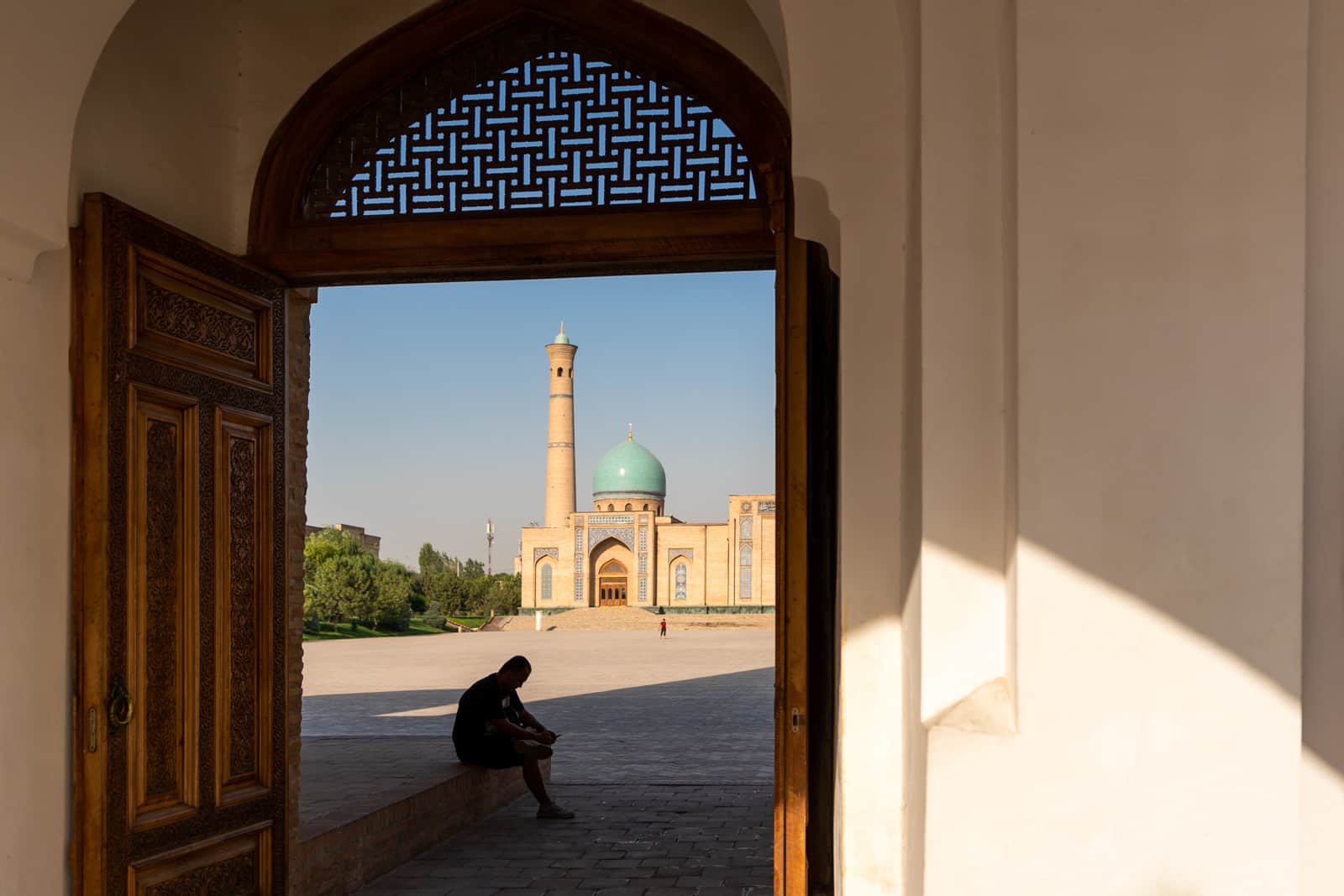 Man sitting in Khast Imam complex in Tashkent, Uzbekistan