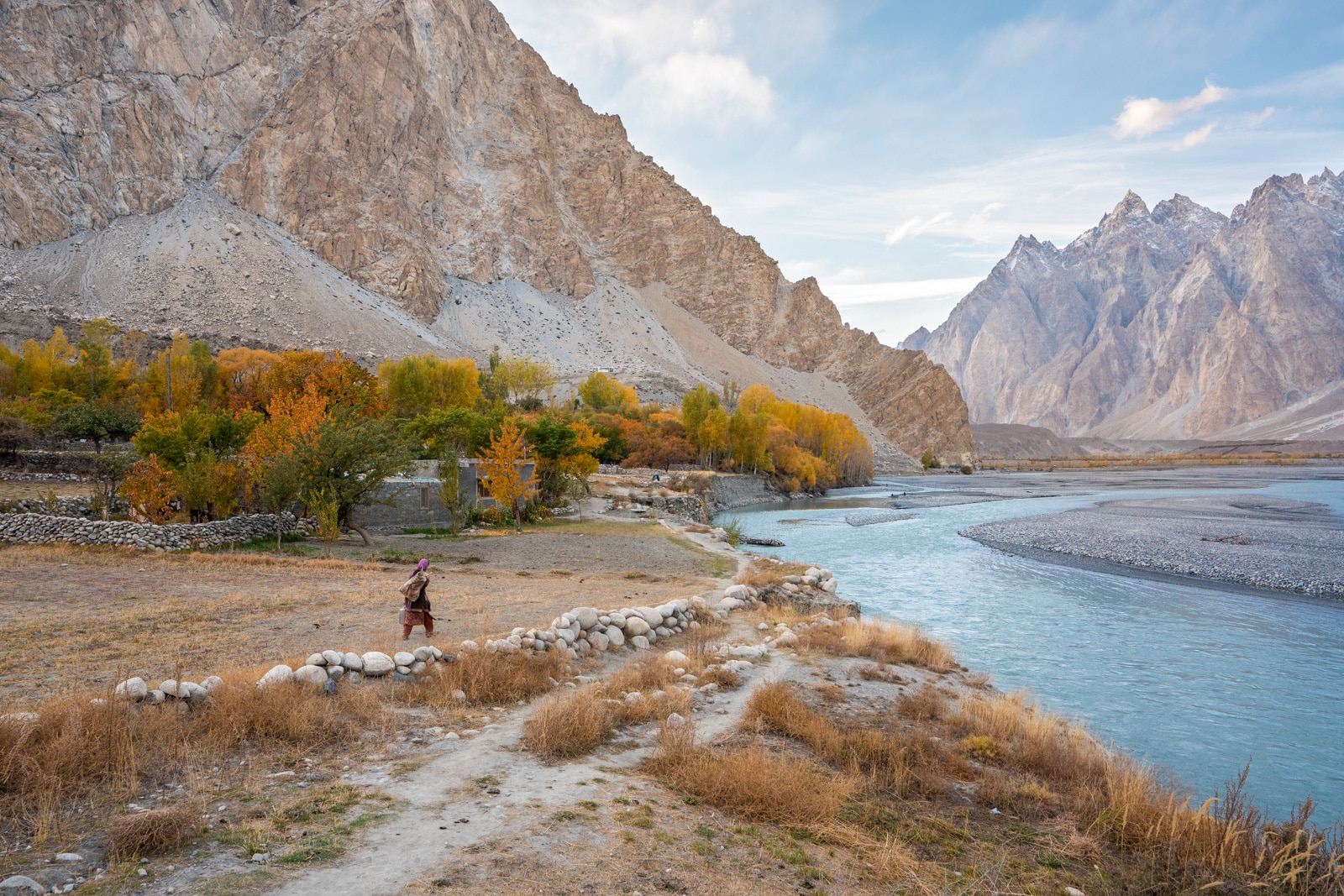 Woman walking in Passu, Pakistan