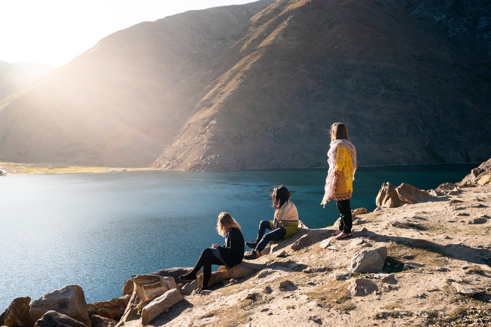 Women looking at Lulusar Lake near the Karakoram Highway, Pakistan