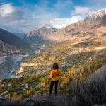 Solo female traveler in Pakistan overlooking Hunza valley from Eagle's Nest Viewpoint