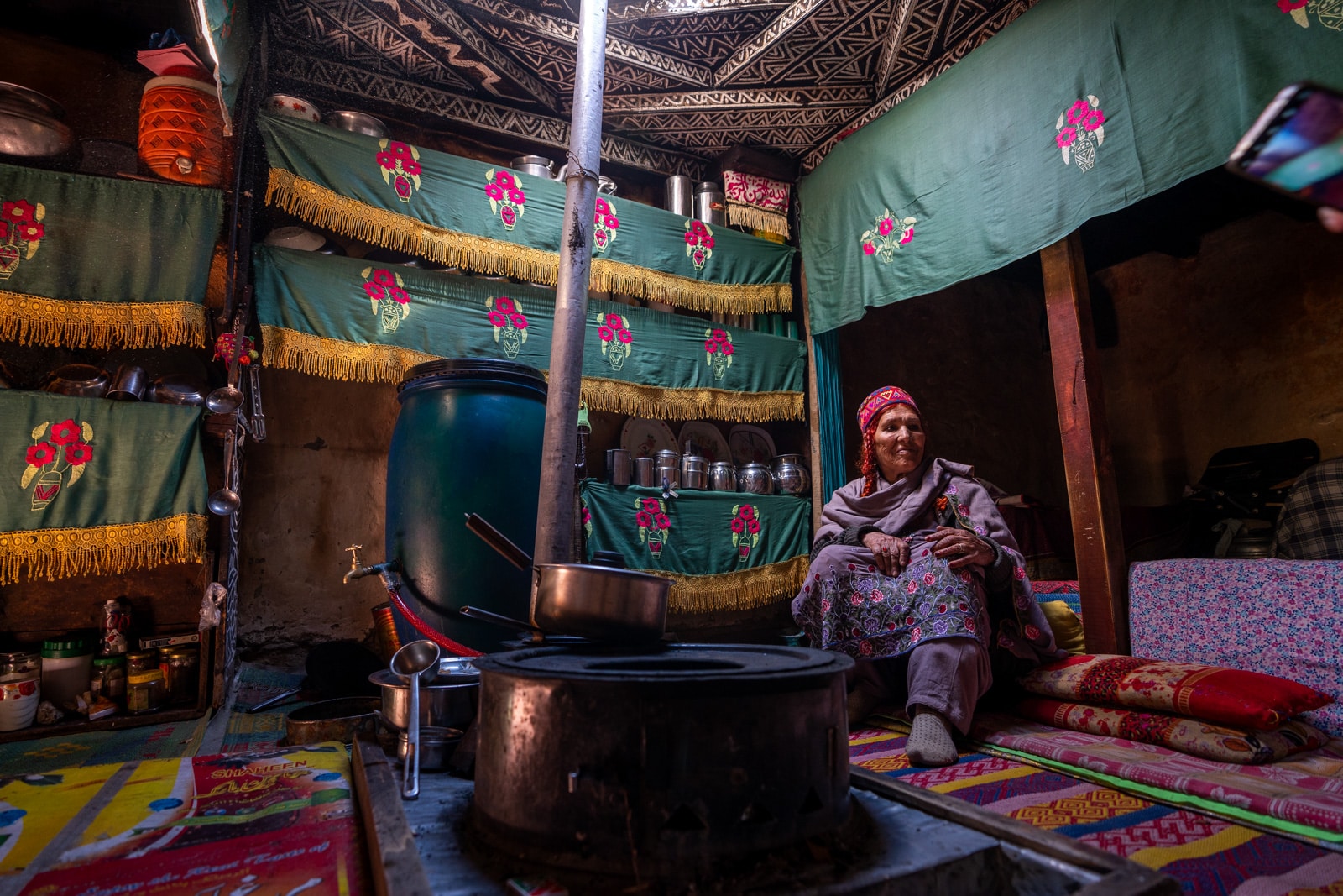 Woman sitting in a kitchen in Phander, Gilgit Baltistan, Pakistan