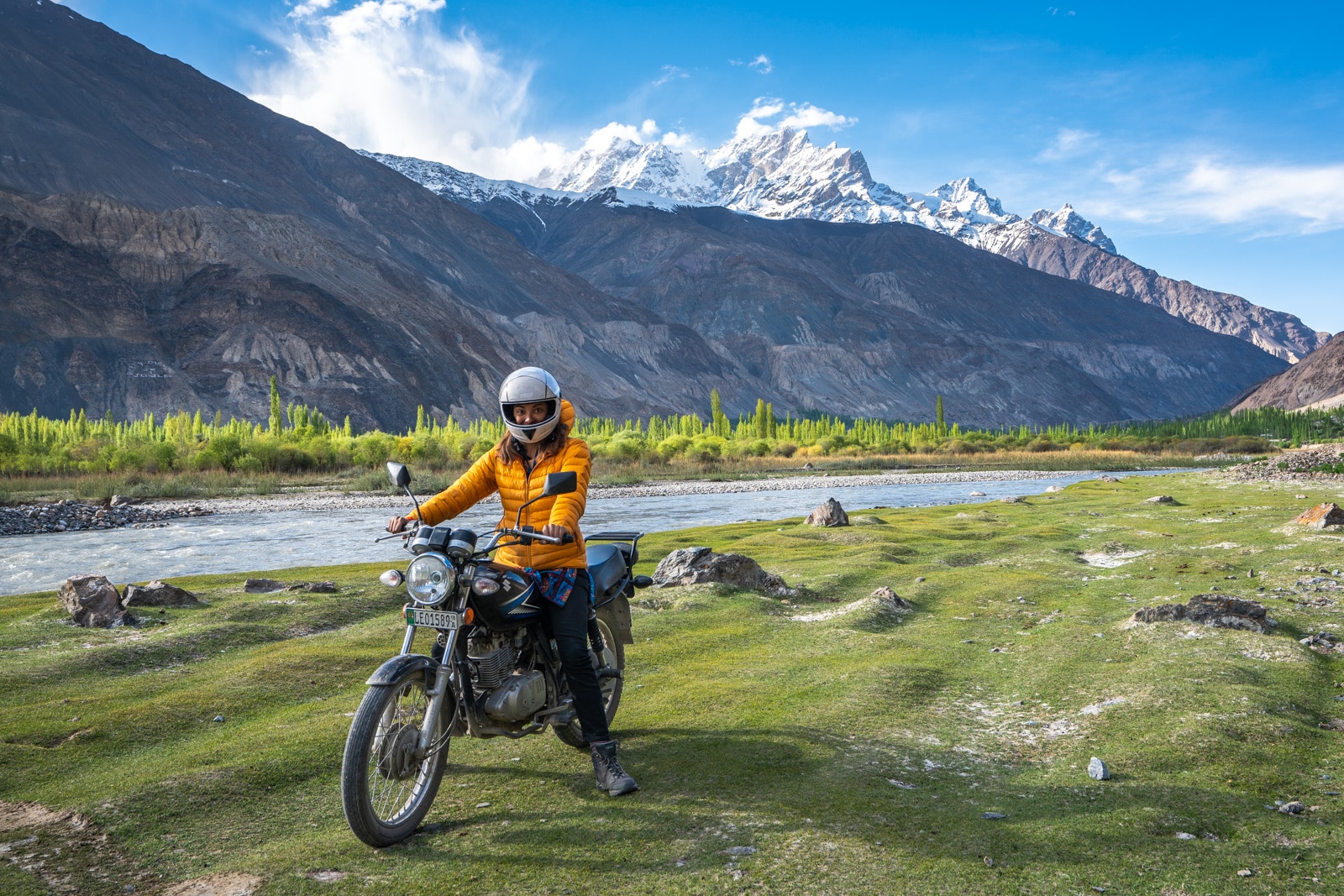 Woman motorbiking in Yasin Valley, Gilgit Baltistan, Pakistan