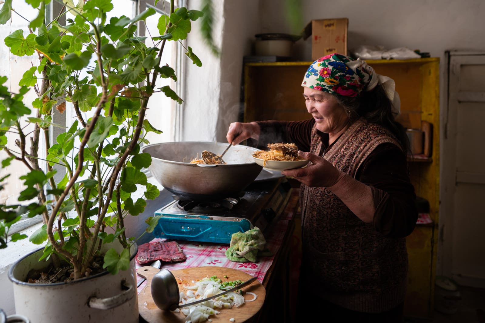 Woman cooking at a homestay in Shaimak village, Pamir, Tajikistan