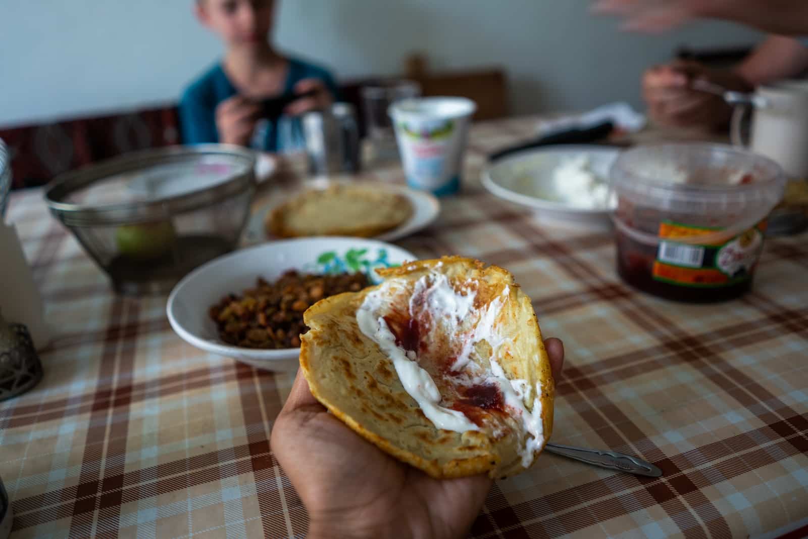 Russian blini pancakes with tvorak cheese and jam in northern Lake Baikal, Siberia, Russia