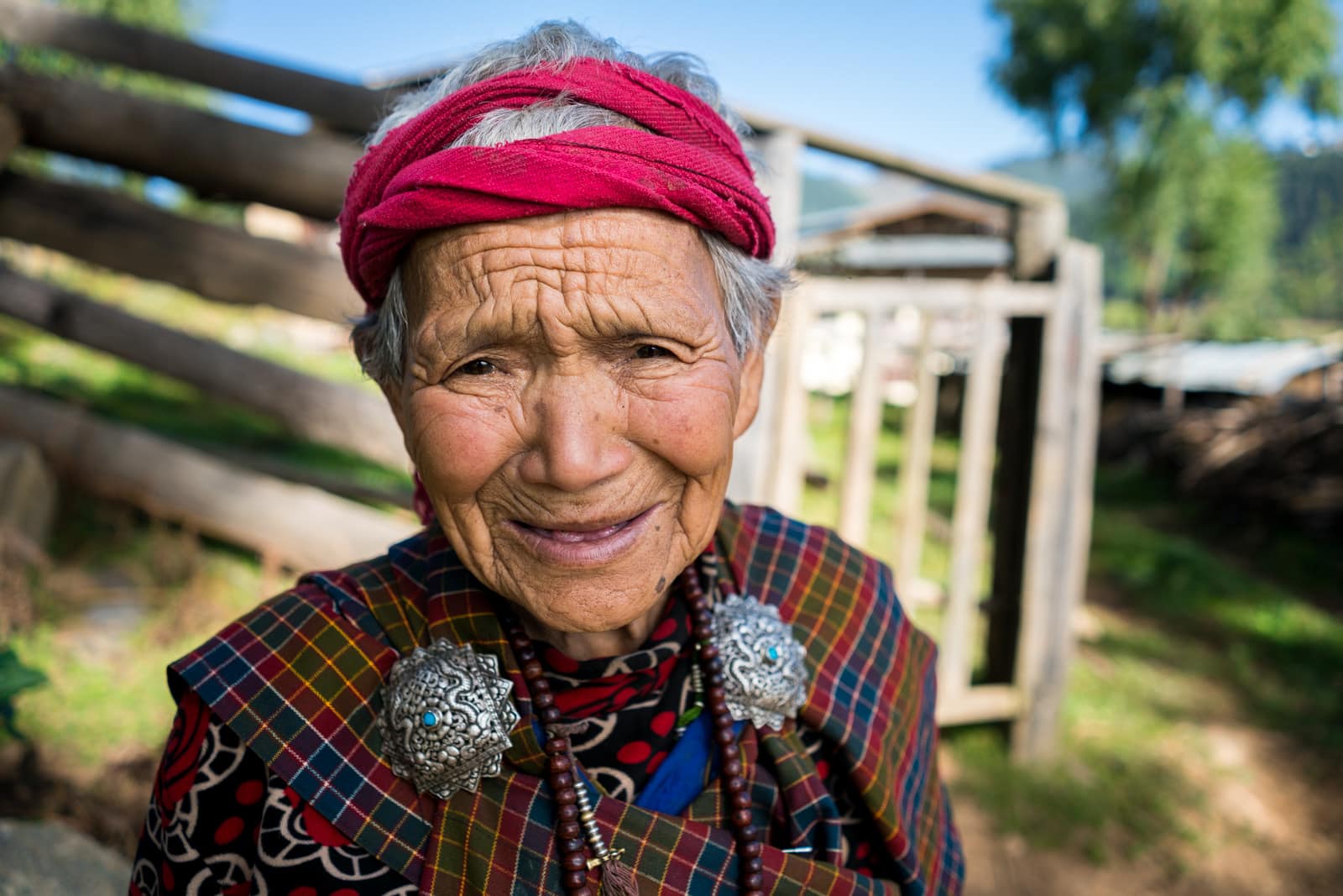 Old Bhutanese woman laughing in Phubjika Valley