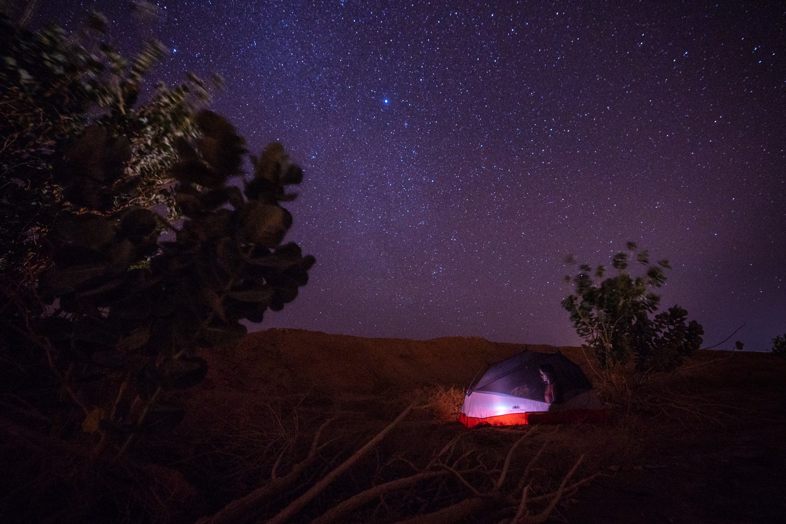 Girl camping on roadside in Saudi Arabia