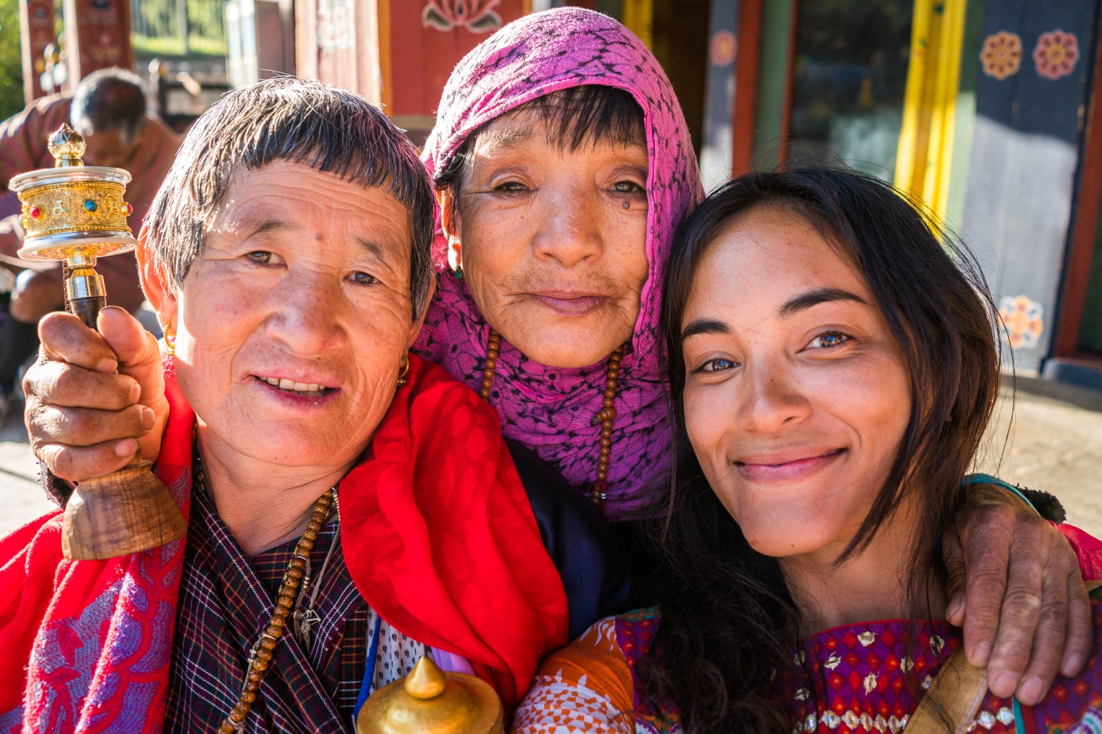 Female traveler with local women in Thimphu