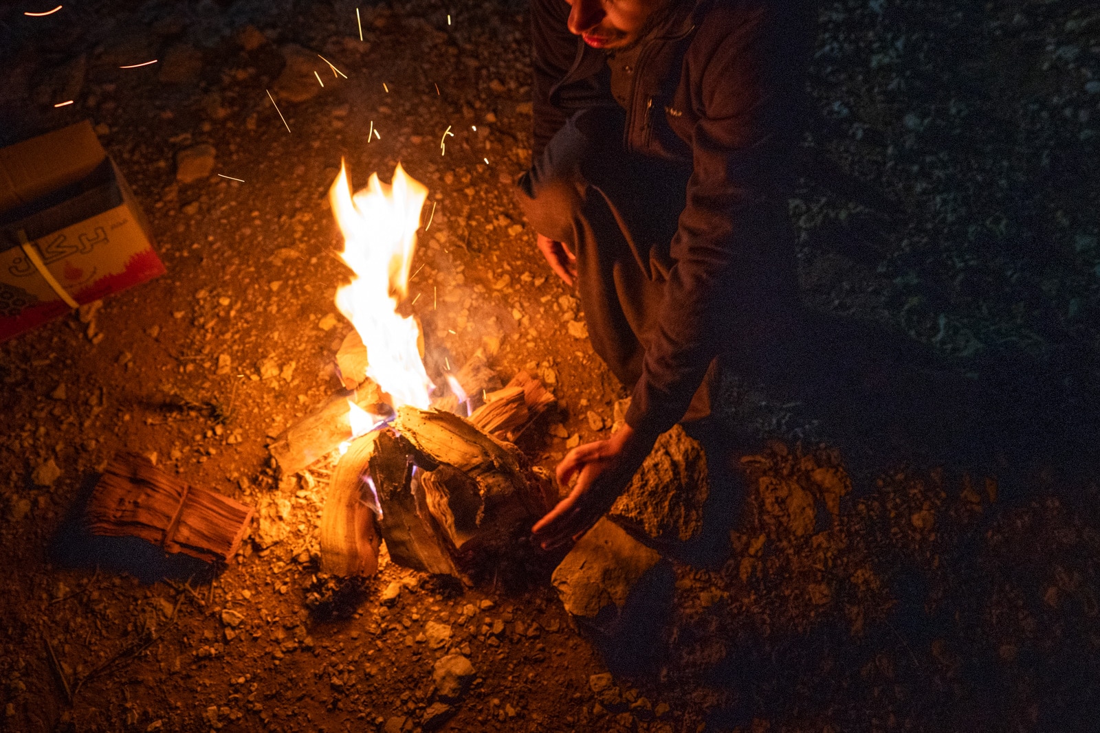 Saudi man making a campfire near Riyadh, Saudi Arabia