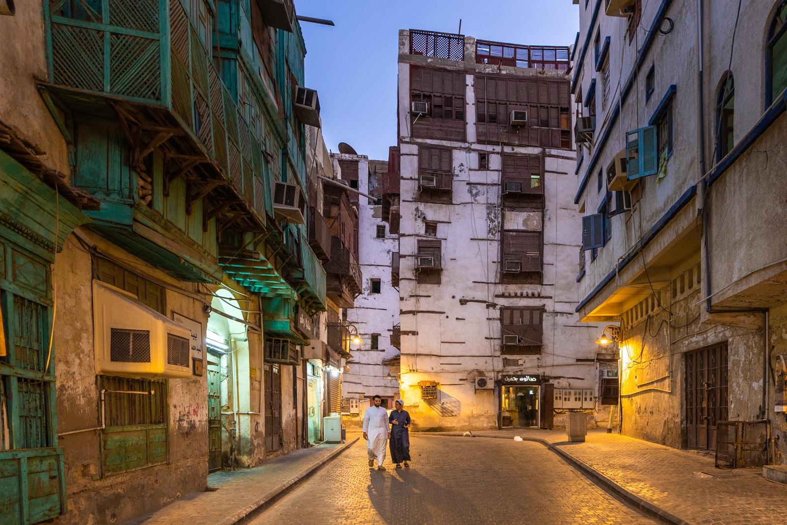 Men walking around historic Al Balad, the old city of Jeddah, Saudi Arabia