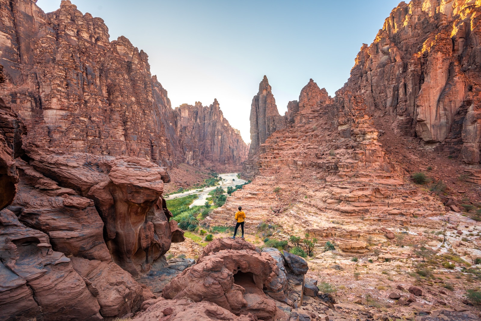 Female traveler standing in Wadi Disah, Saudi Arabia