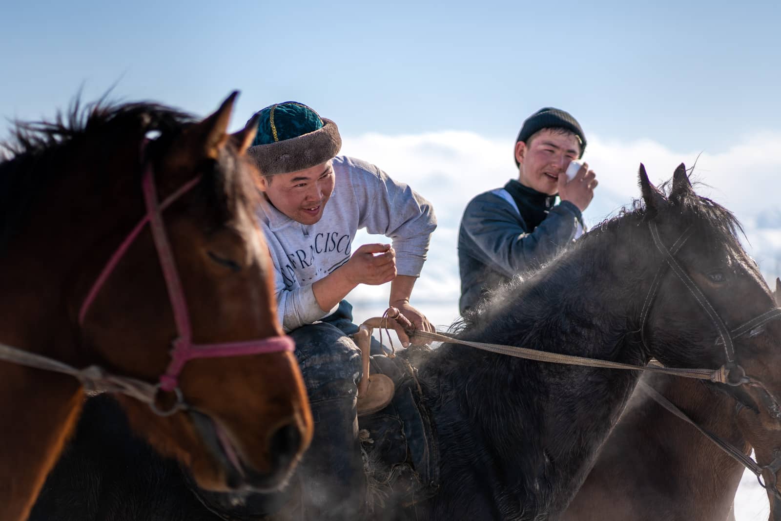 Kok buru players on horses in Kyrgyzstan in winter