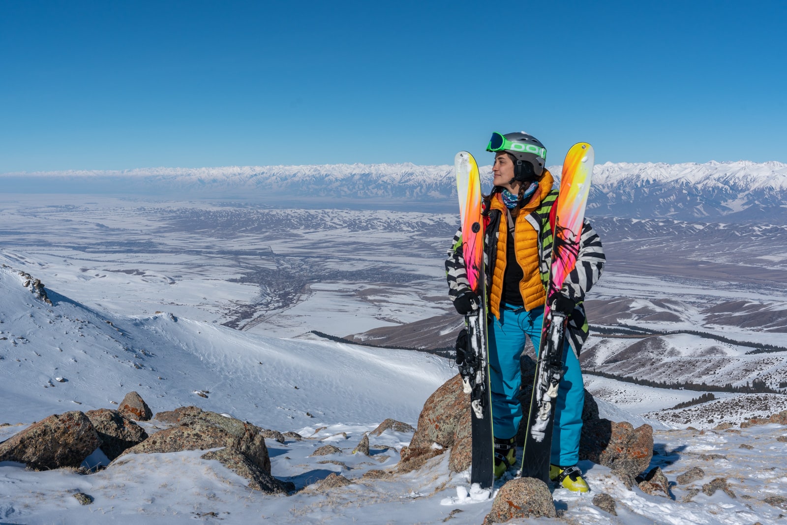 Female traveler skiing in Kyrgyzstan