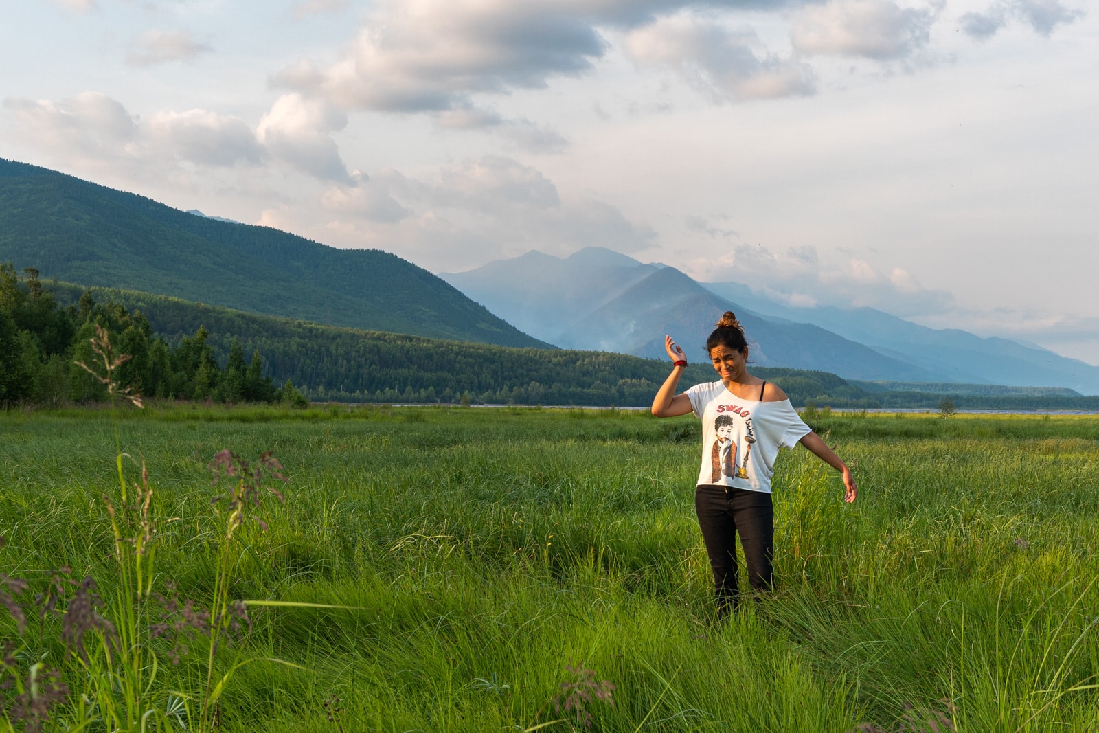 Traveler getting eaten by mosquitoes at Lake Baikal, Russia