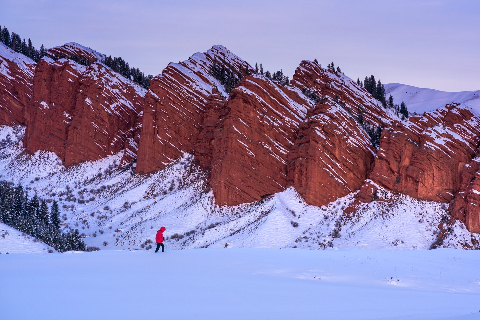 Man walking in Jety Oguz, Kyrgyzstan at sunrise