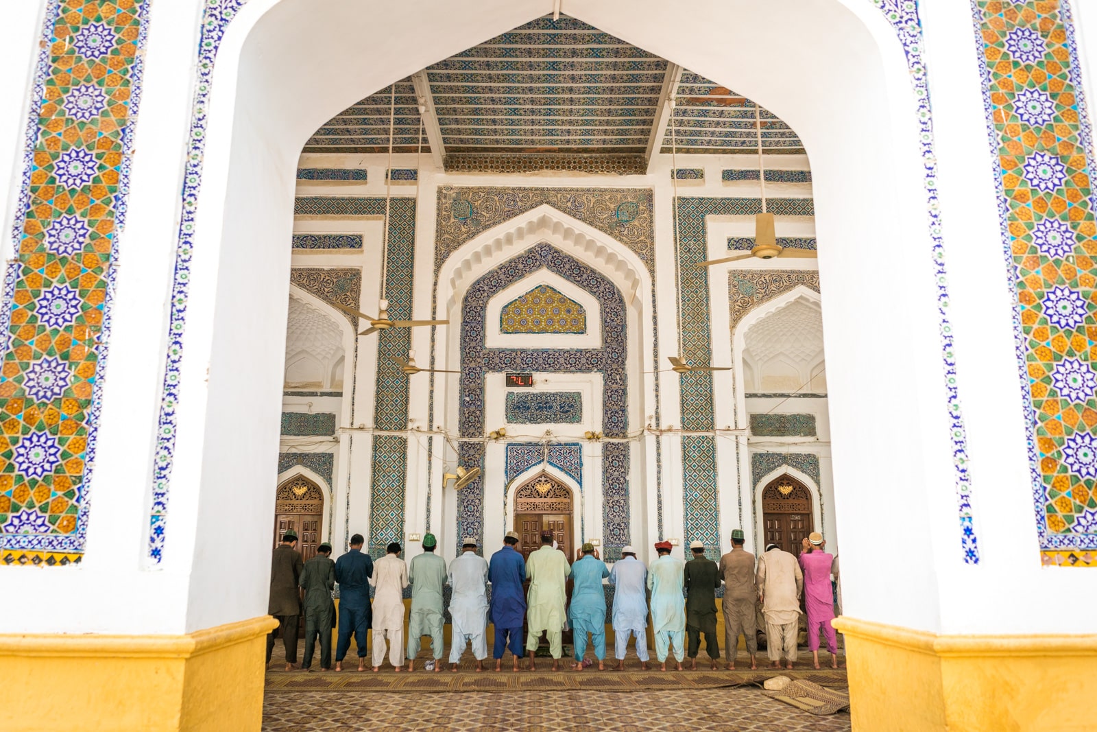 Men praying at a shrine in Hala, Sindh, Pakistan