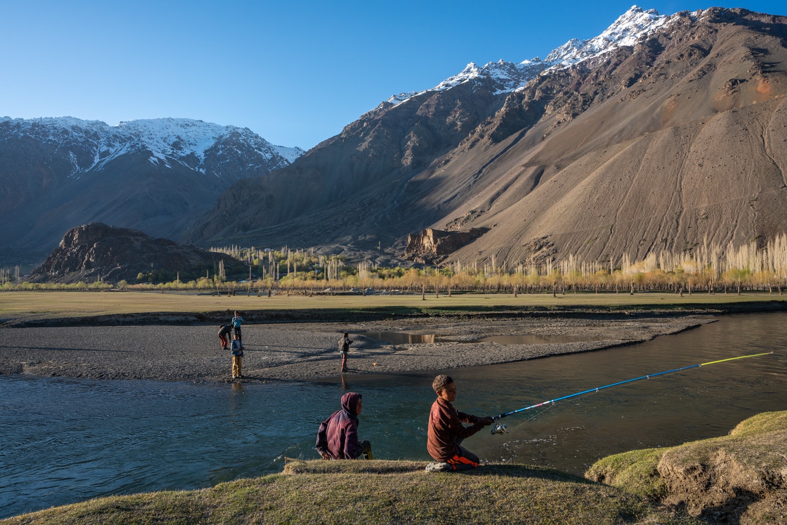 Young boys fishing in Phander, Gilgit Baltistan