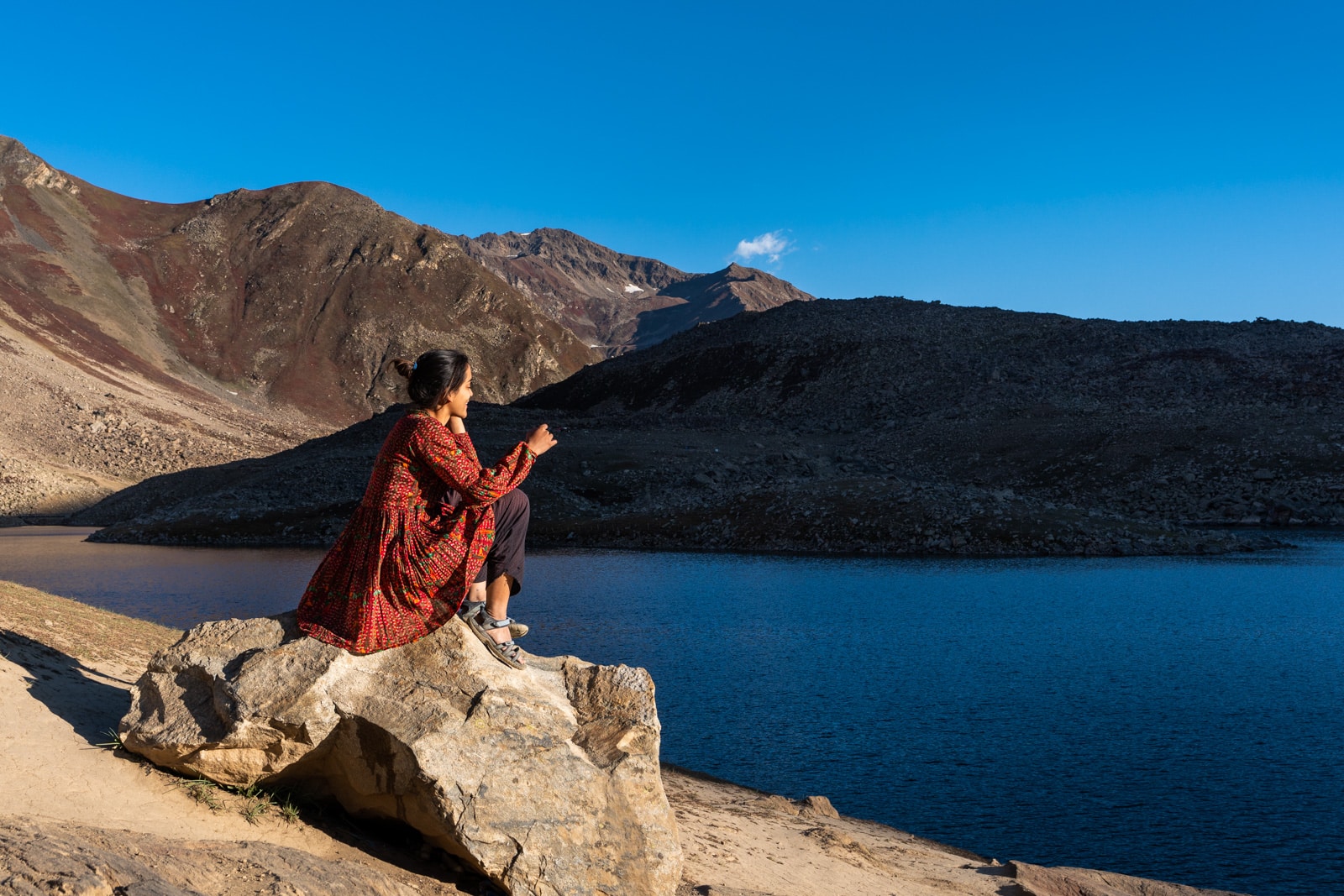 Female traveler at Lulusar Lake in Pakistan