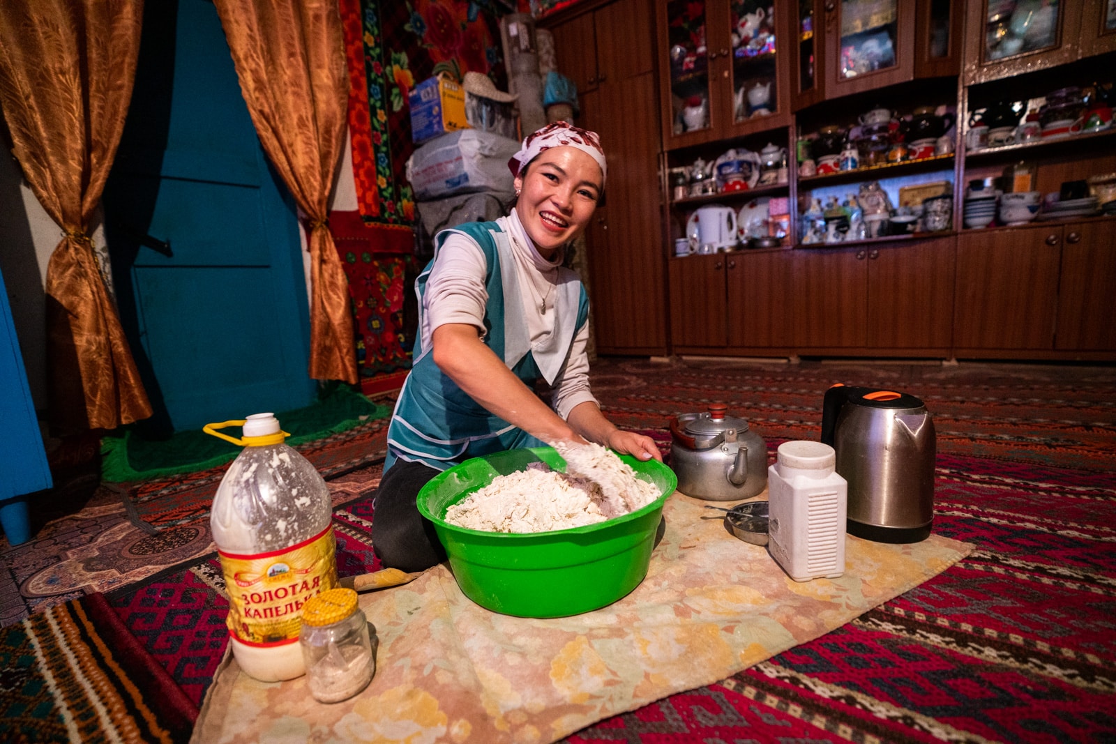 Aika making bread dough in Murghab, Tajikistan