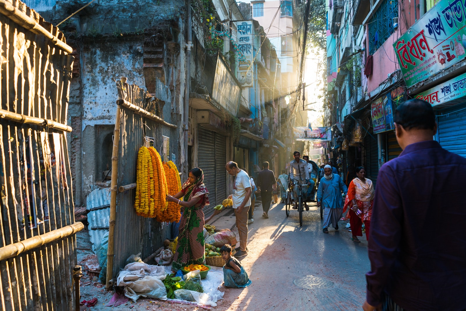 Light breaking on a street with flowers in Dhaka, Bangladesh