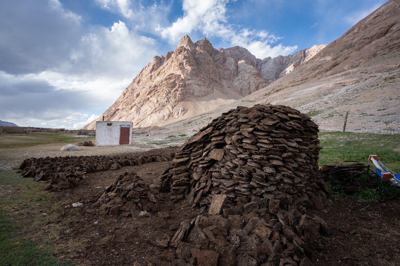 Pile of cow dung for fires in Shaimak, Tajikistan