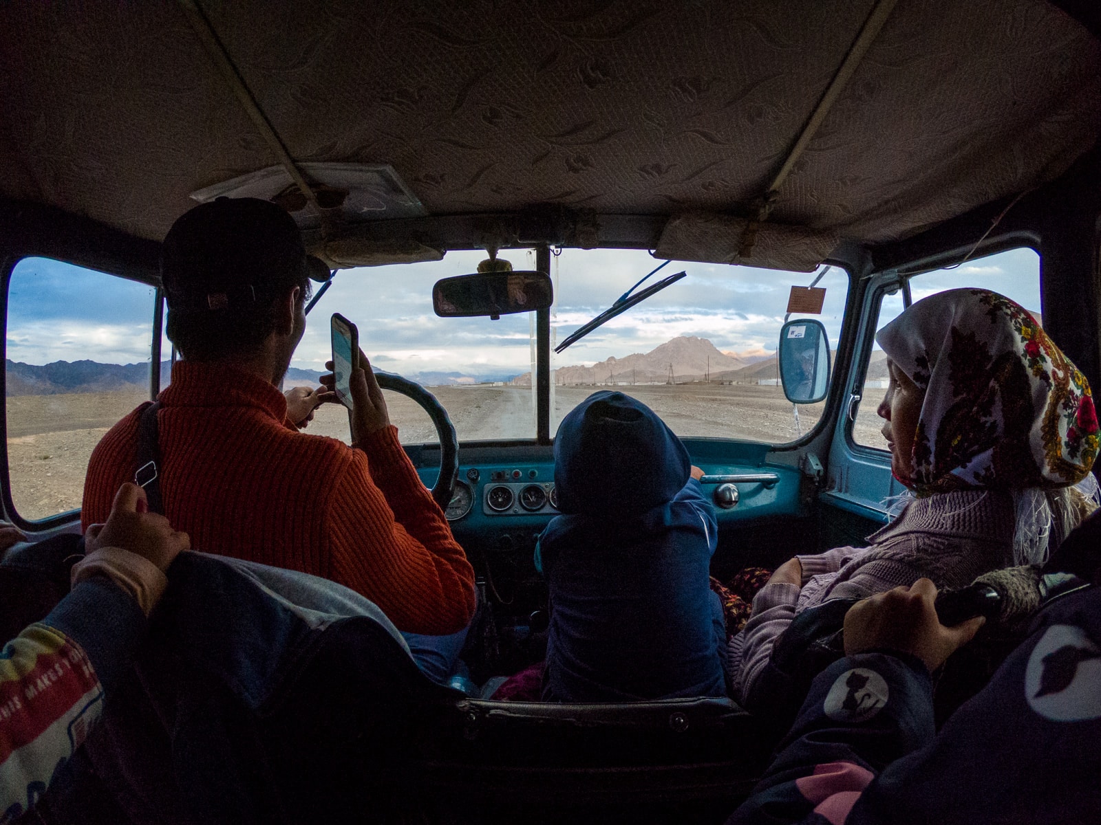 Jeep interior driving passengers to Shaimak, Tajikistan