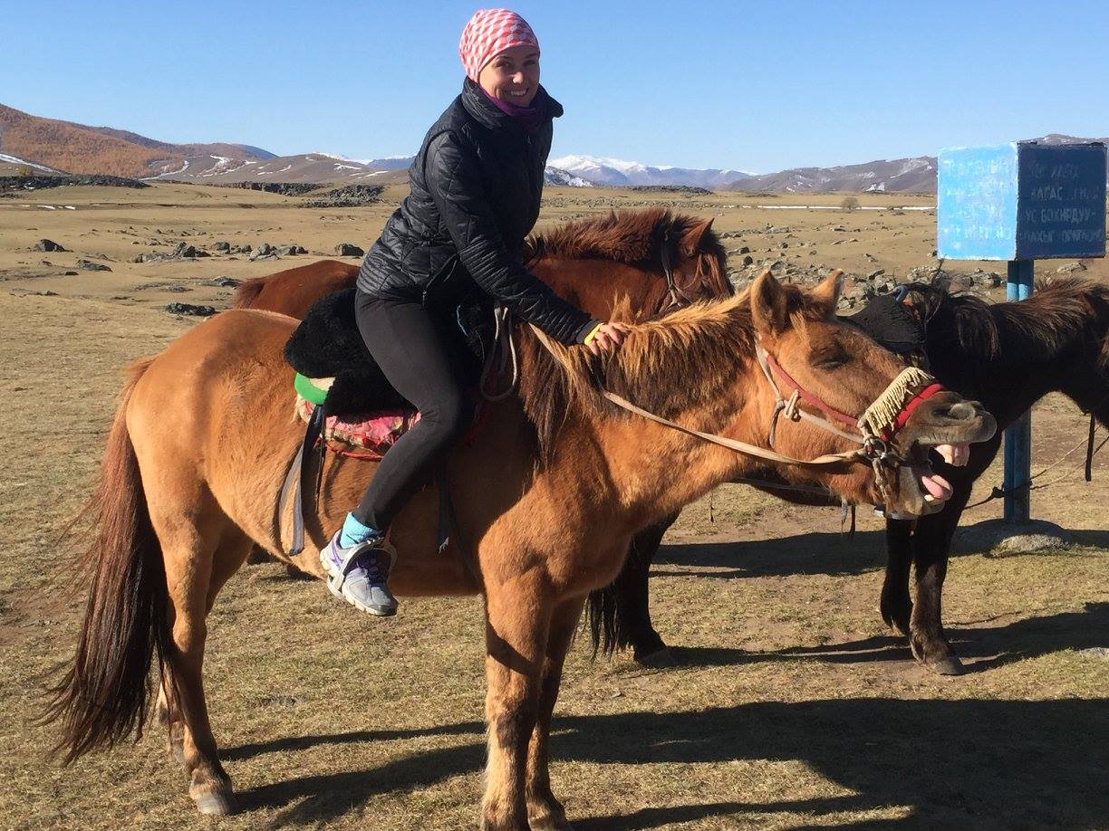 Ana on a horse in Mongolia