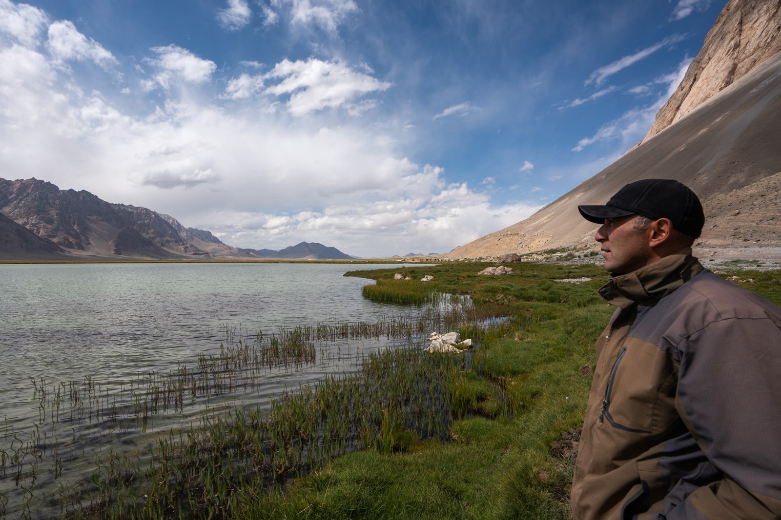 Local man at a lake in the Pamir Mountains of Eastern Tajikistan