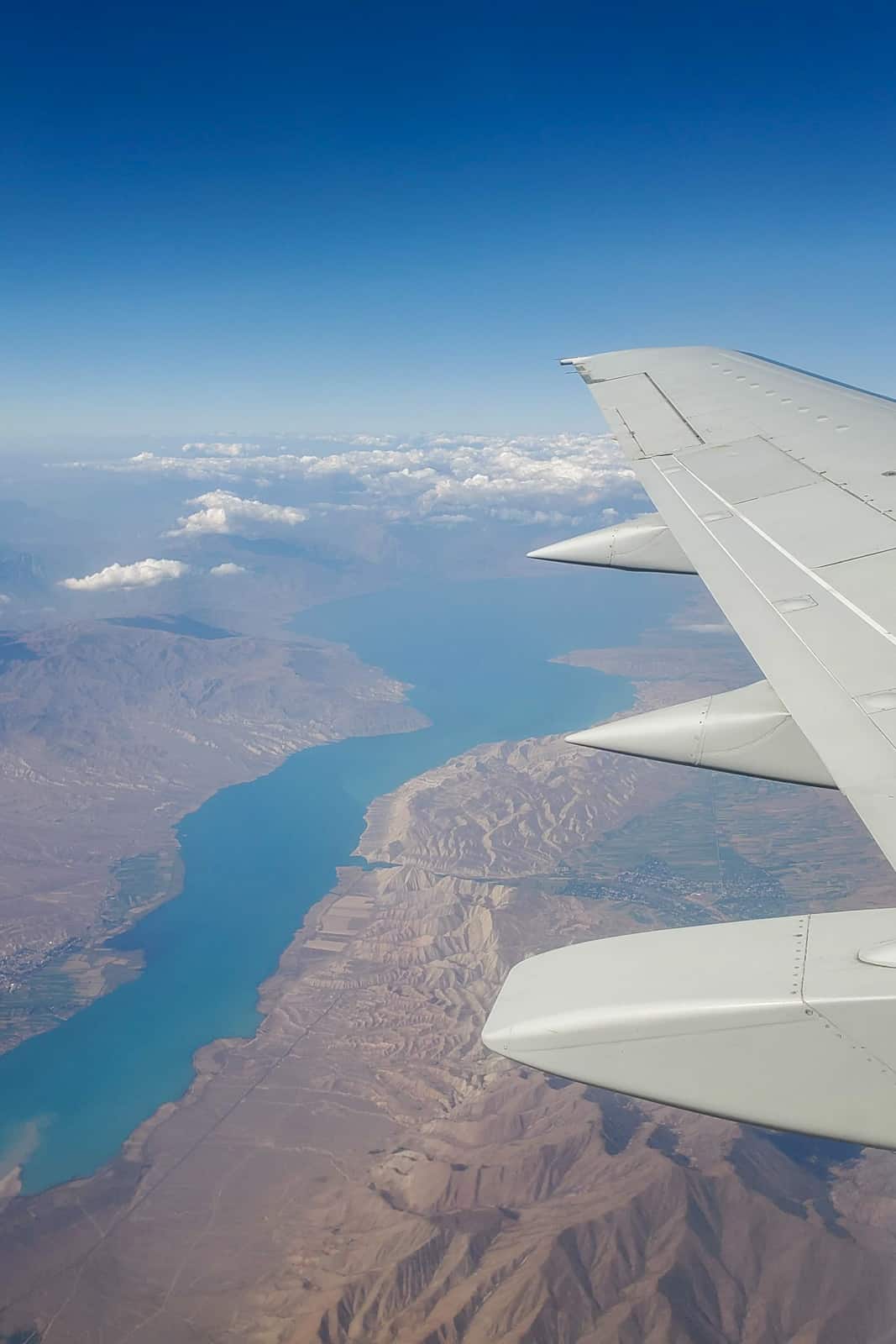 Plane wing over a lake in Kyrgyzstan