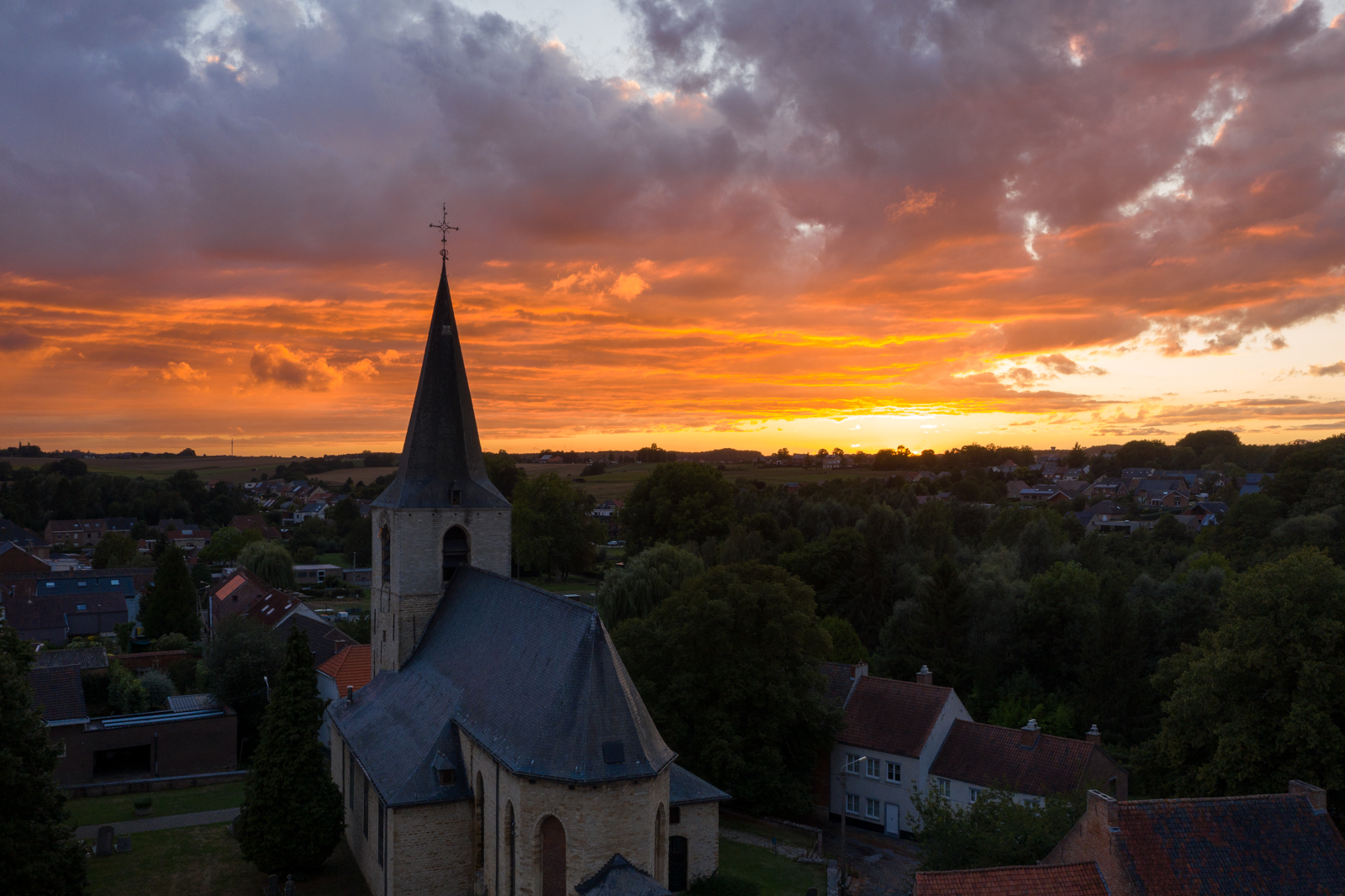 Stunning sunset over St. Lambertus Church in Leefdaal, Flemish Brabant, Belgium