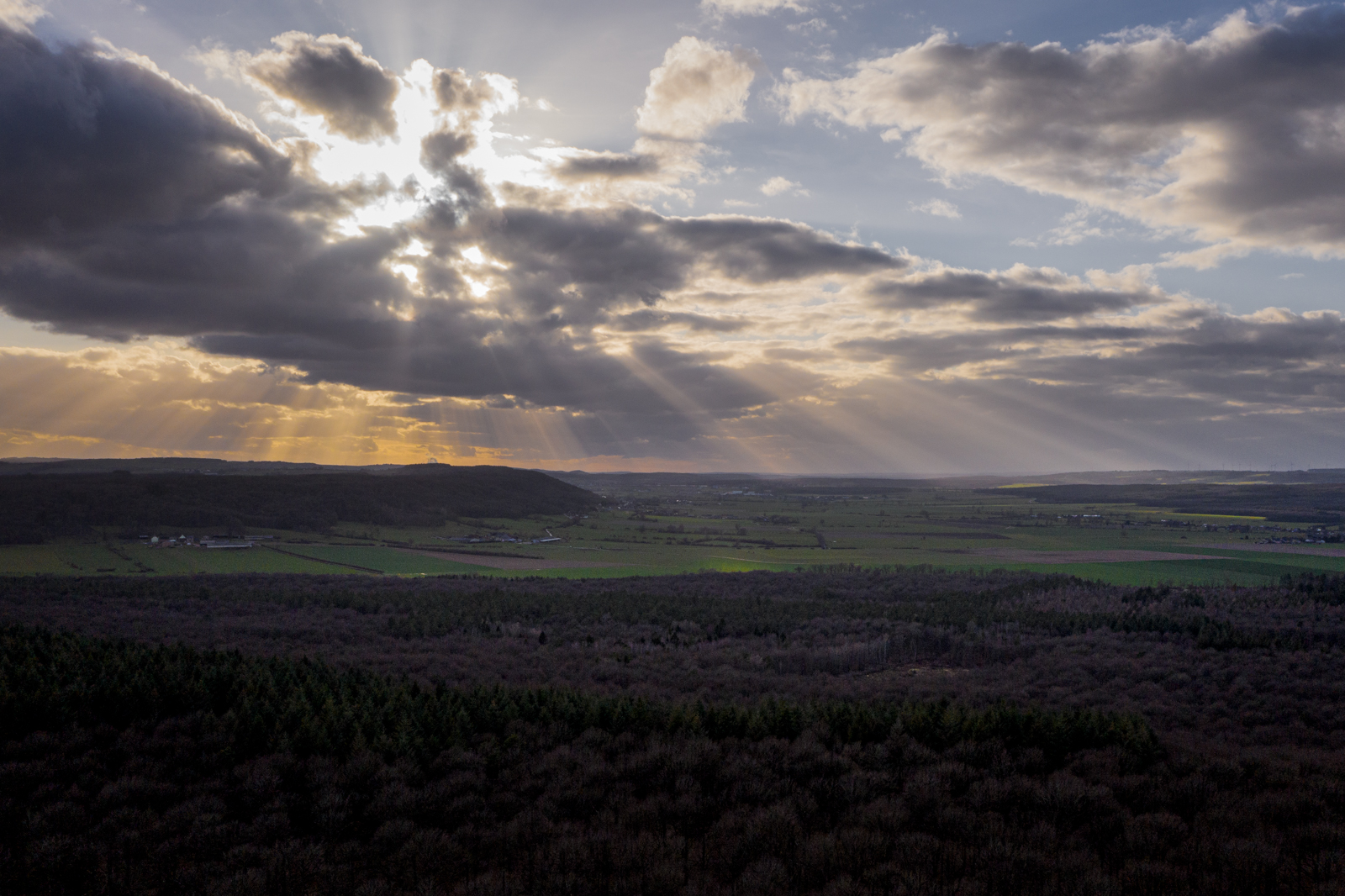 Rays of light breaking through clouds over Wallonia, Belgium