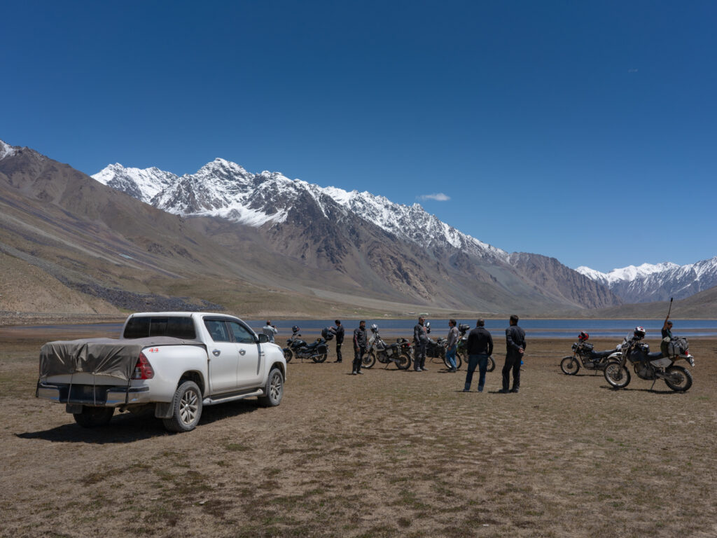 Recovery vehicle and tour group at Shandur Pass, Pakistan