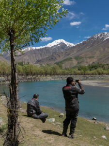 Bikers relaxing in Phander Valley on a Pakistan adventure motorcycle tour