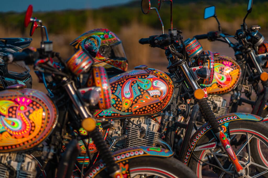 Suzuki GS 150 motorcycles covered in Pakistani truck art