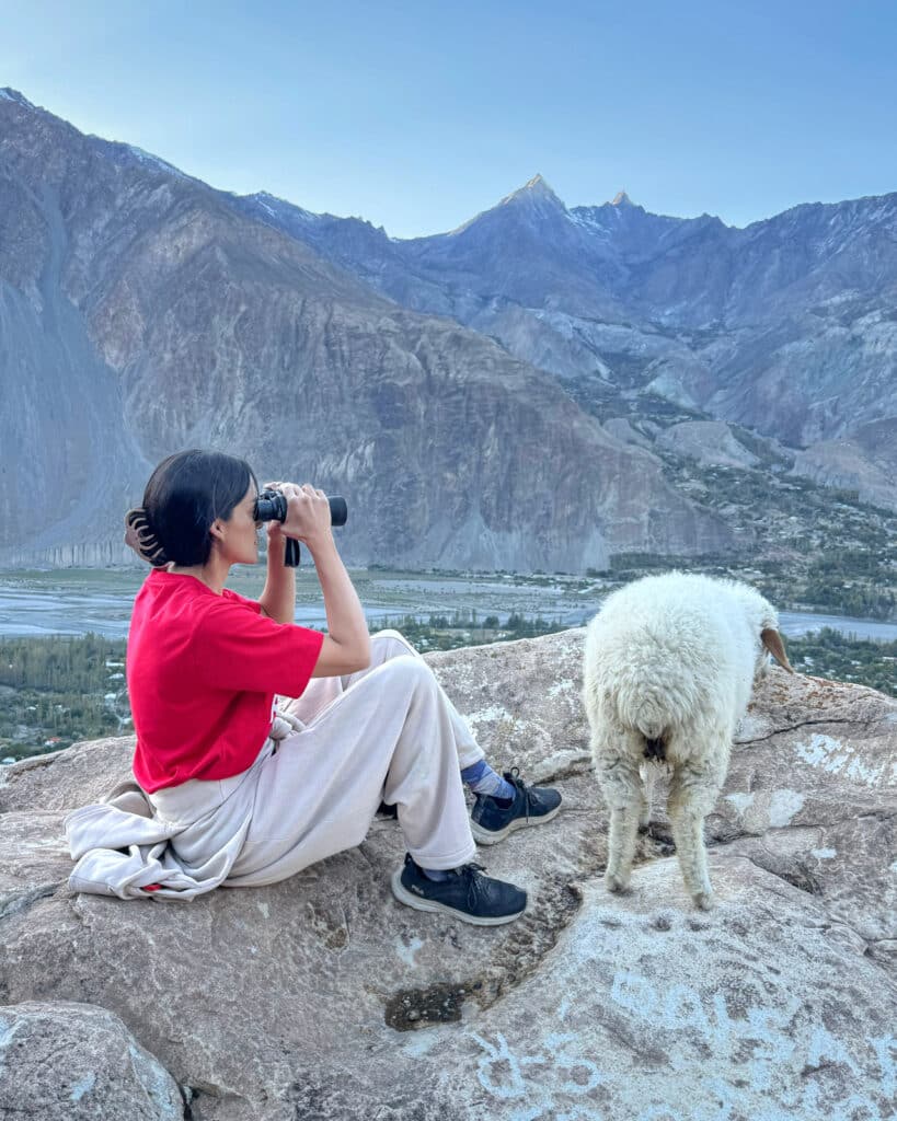 Alex on the lookout with her sheep in Ishkoman