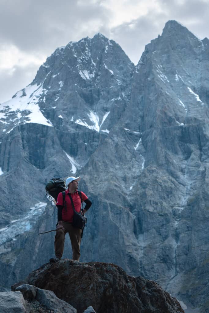 Hakim the trekking guide standing in front of Shani Peak on the way to the Pakora Pass (Naltar Pass)